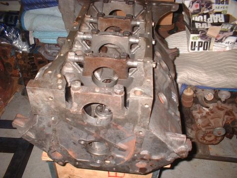 1964 Ford Galaxie - An engine block is shown in detail, with parts of other engines and boxes in the background.