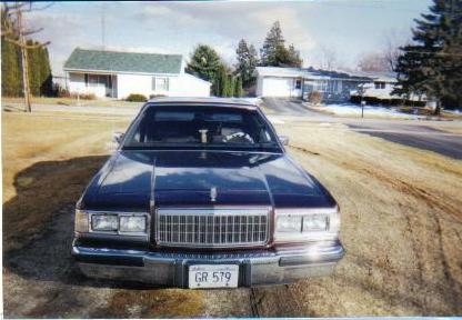 1990 Mercury Grand Marquis - Front view of a 1990 Mercury Grand Marquis parked in a driveway.