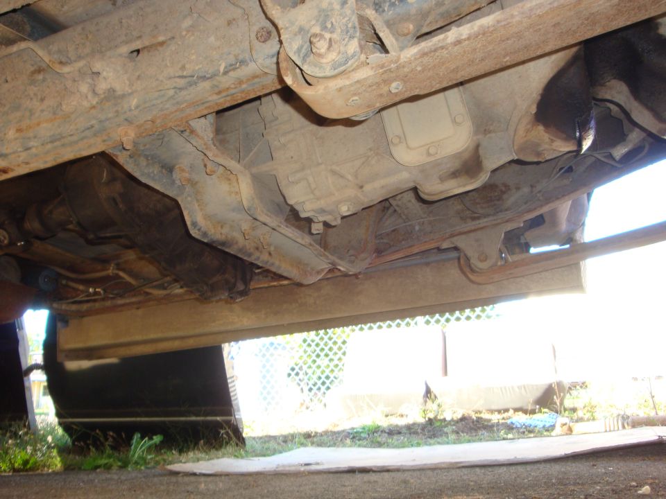 Undercarriage view showing transmission and frame components