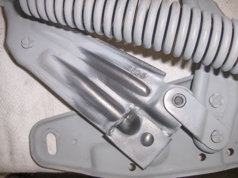 1970 Chevrolet Camaro - Close-up of a vehicle hood hinge and spring assembly, showing part number 524.