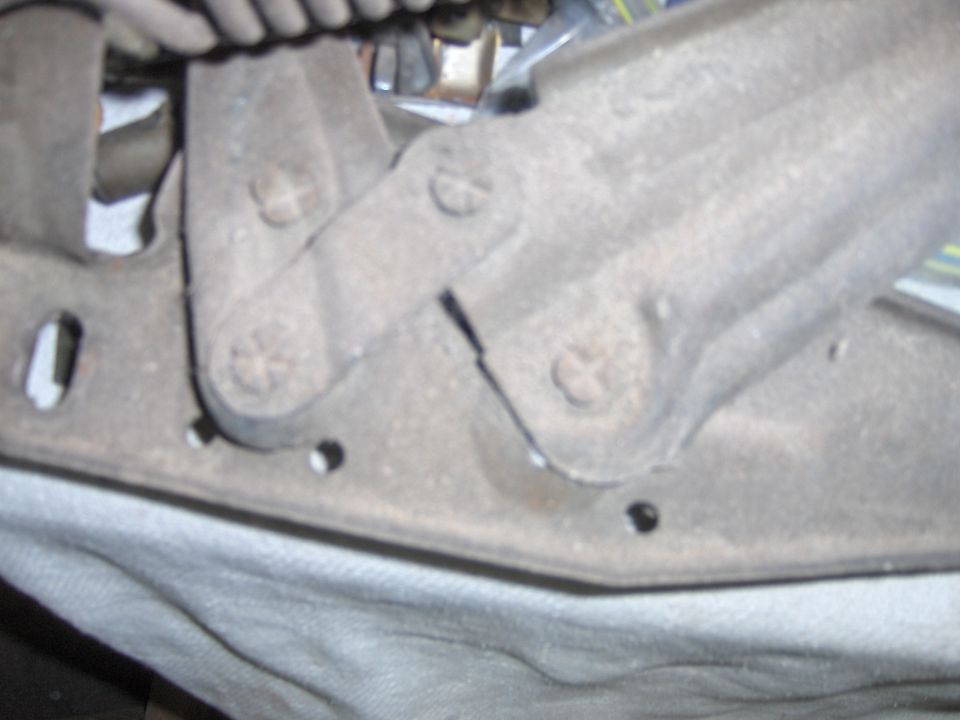 1970 Chevrolet Camaro hood hinge mechanism, showing rust and wear