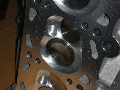 1992 Ford Crown Victoria - Close-up view of a polished engine cylinder head, highlighting the intake and exhaust ports.