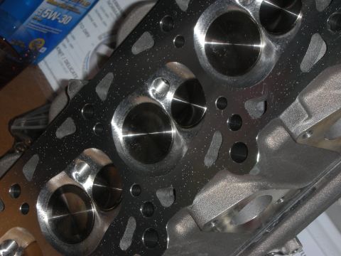 1992 Ford Crown Victoria - A close-up view of a car's engine cylinder head, showing the intake and exhaust ports and valves.