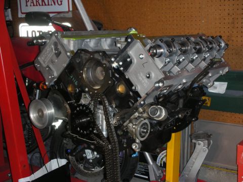 1992 Ford Crown Victoria - Engine block assembly with visible timing chain and pulley system.