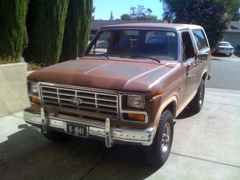 1986 Ford Bronco - This 1986 Ford Bronco is shown in a 3q-front view, with its distinctive body style and brown paint.