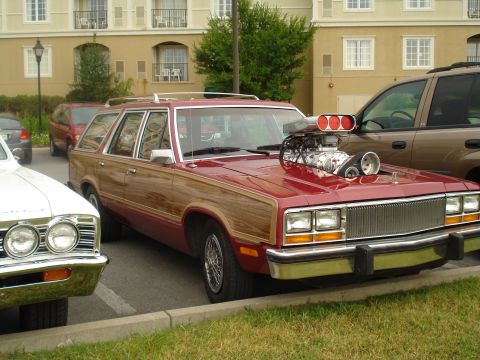 1994 Ford F-350 - This modified station wagon features a large supercharger protruding from its hood.