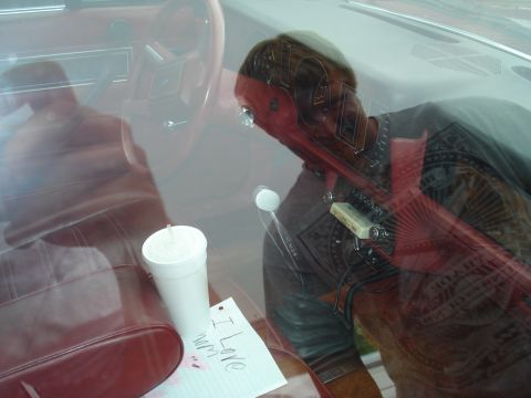1994 Ford F-350 - A handwritten note and a drink sit on the seat inside a vintage vehicle.