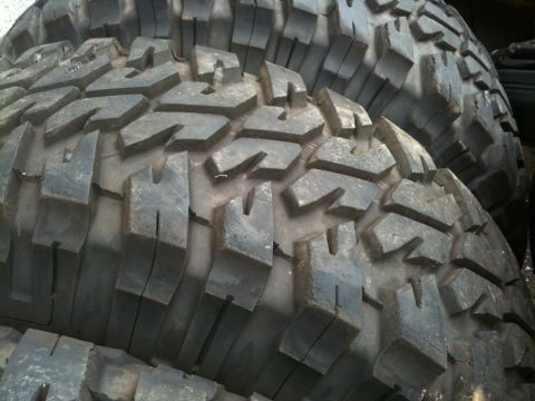 1995 Ford Bronco - A stack of off-road tires, ready for tough terrain.