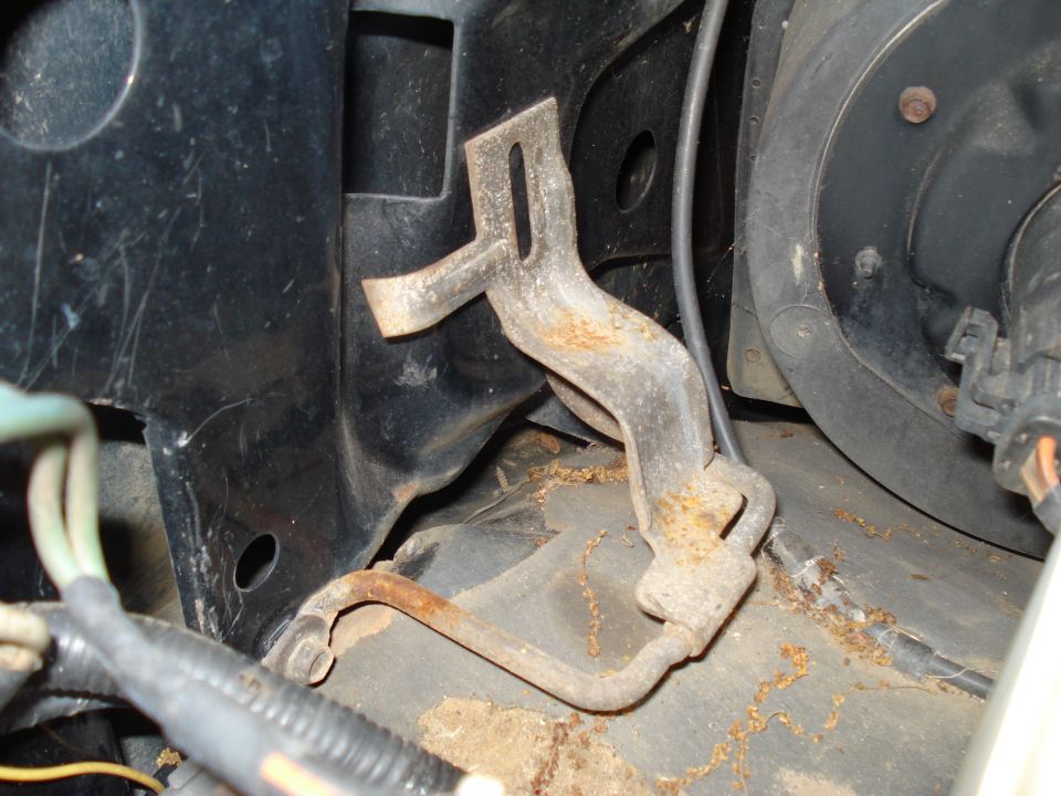 Rusty engine bracket with mounting holes