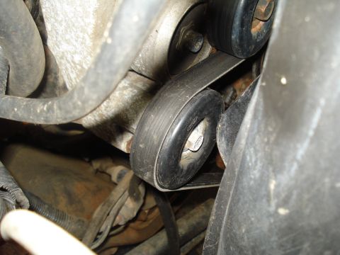1994 Ford F-350 - Close-up view of engine belt and pulleys, with a watermark indicating the source.
