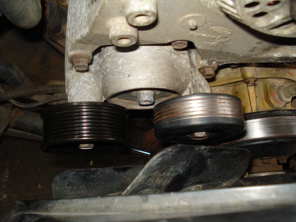 Engine pulleys and fan with visible Ford logo