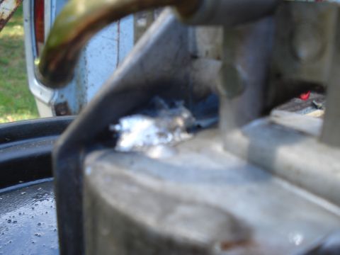 1994 Ford F-350 - A carburetor part shows a repair made with aluminum foil.