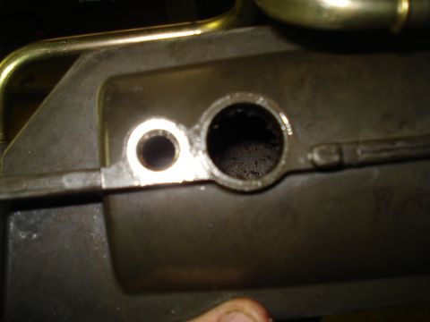 1994 Ford F-350 - This is a close-up view of an engine component, showing two distinct holes.