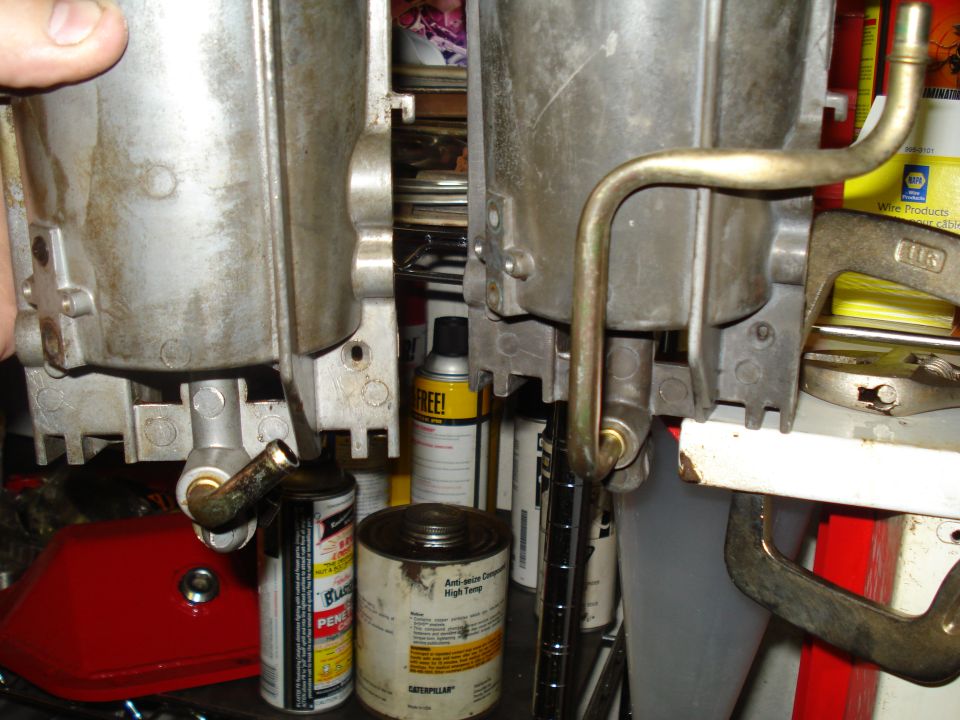 Two carburetors with metal fuel lines