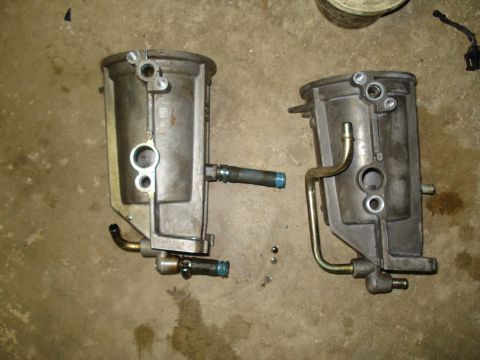 1994 Ford F-350 - Two fuel filters are shown side-by-side on a concrete surface.