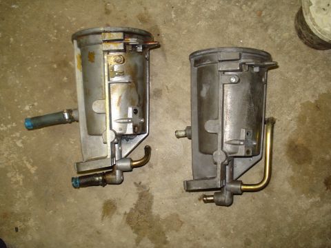1994 Ford F-350 - Two used fuel filters are shown side-by-side on a concrete floor.