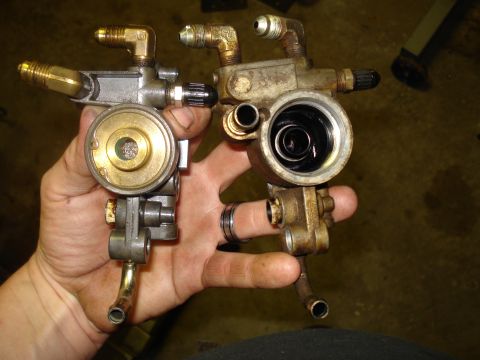 1994 Ford F-350 - Comparison of two oil filter housings, one appears to be a replacement part.