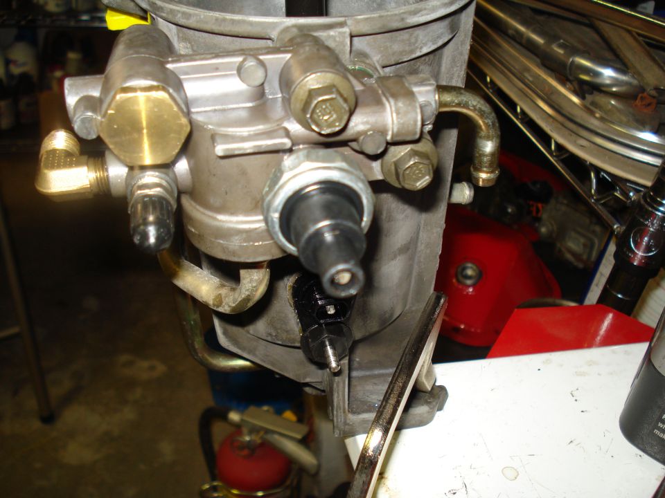 Carburetor assembly with brass fittings and black sensor