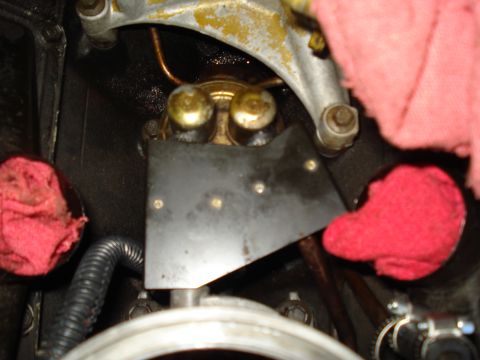 1994 Ford F-350 - This photo shows a close-up view of an engine component, likely a fuel pump, with red rags used to protect the area.