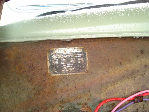 1994 Ford F-350 - A Ford VIN plate is visible on a rusty panel, with electrical wires in the foreground.