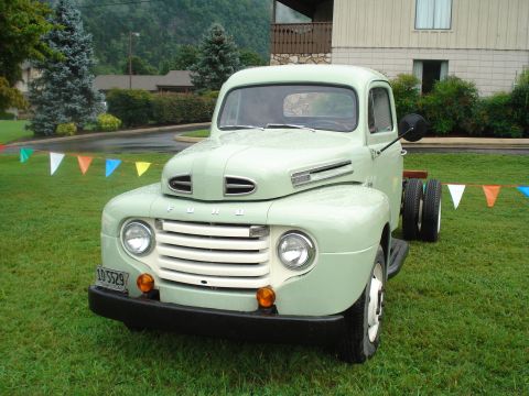 1994 Ford F-350 - This vintage Ford truck features a distinctive grille and dual rear wheels, suggesting it's from the early 1950s.