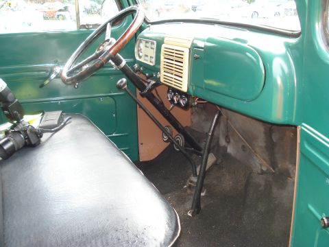 1994 Ford F-350 - The interior of a vintage truck, a large steering wheel and a column shifter.