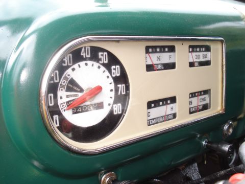 1994 Ford F-350 - Close-up of a vintage vehicle's dashboard, a speedometer and auxiliary gauges for fuel, oil, temperature, and battery.
