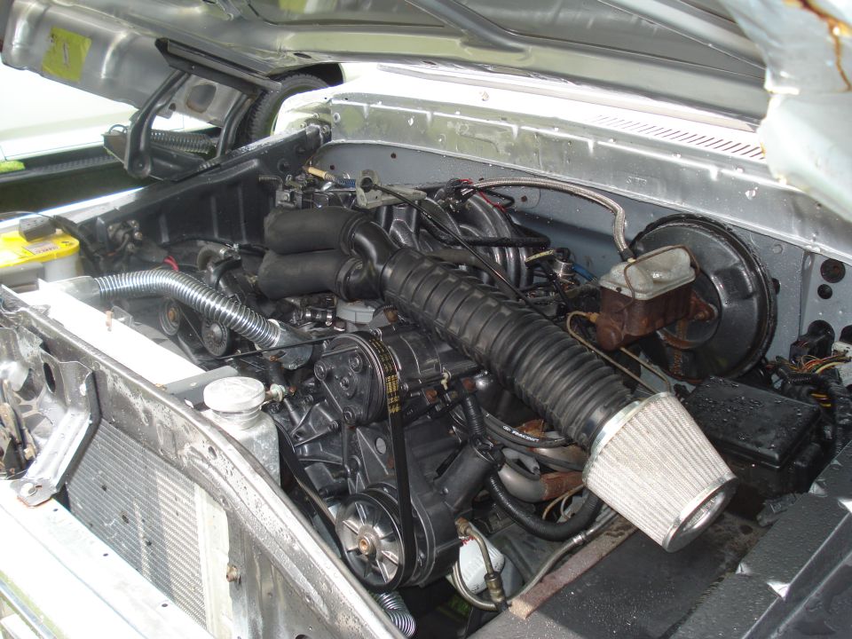 Engine bay with V8 engine, air intake, and radiator