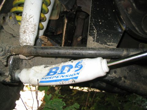 1986 Ford Bronco - Close-up of a BDS Suspension shock absorber, part of the vehicle's off-road suspension system.