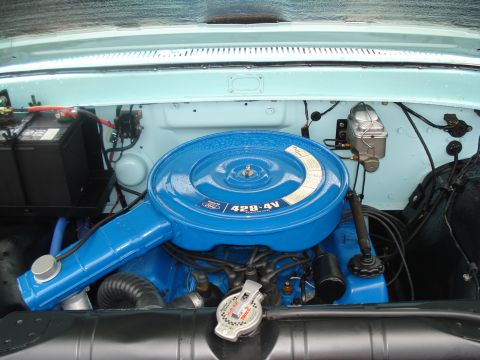 1994 Ford F-350 - Close-up of a clean engine bay a blue air cleaner with "429-4V" and "Ford" markings.