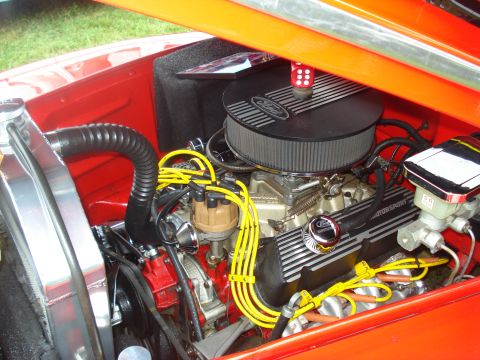 1994 Ford F-350 - Close-up of a V8 engine bay a Ford air cleaner and yellow spark plug wires.