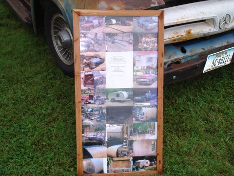 1994 Ford F-350 - A display board with multiple photos documenting a truck restoration project, a central document with details.