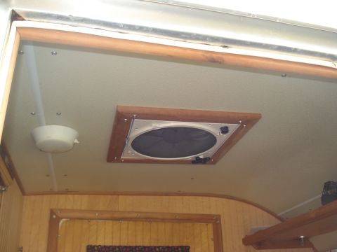 1994 Ford F-350 - Interior view of an RV ceiling showing a vent and a light fixture.