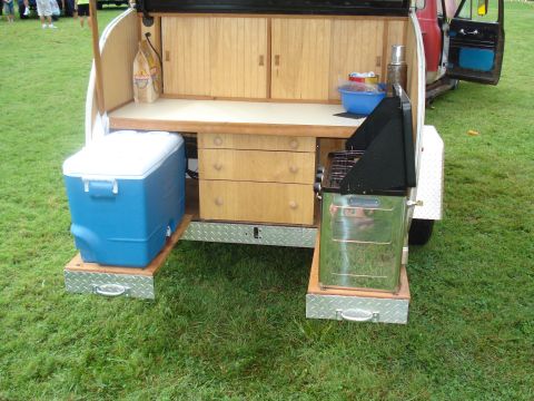 1994 Ford F-350 - This custom teardrop trailer features a pull-out kitchen with a grill and storage drawers.