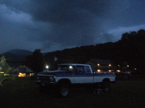 1994 Ford F-350 - This lifted Ford F-Series truck is parked outside at dusk with a cloudy sky overhead.