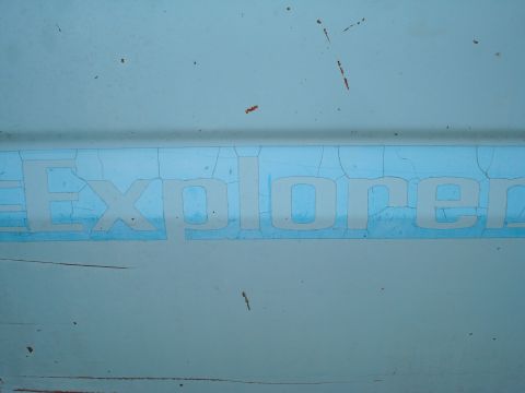 1984 Ford F-250 - Cracked "Explorer" lettering on a vehicle panel, Supermotors.net watermark visible.
