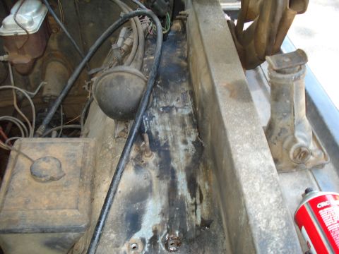 1984 Ford F-250 - Close-up view of the engine bay, revealing the brake fluid reservoir and various engine components.