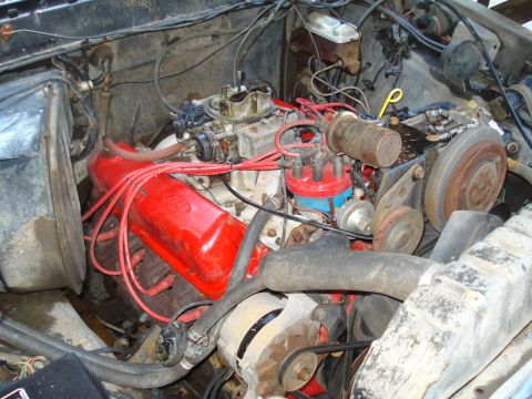 1984 Ford F-250 - Close-up view of a vehicle's engine bay, showing various components and wiring.