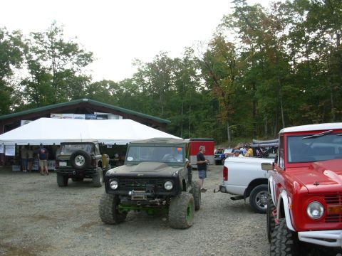 1983 Ford Bronco - A modified 1983 Ford Bronco is parked in front of a tent at an outdoor event.