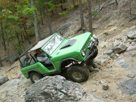 1983 Ford Bronco - This modified Bronco navigates a challenging rocky trail, its off-road capabilities.
