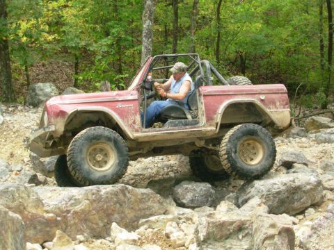 1983 Ford Bronco - This modified Ford Bronco navigates a rocky trail, its off-road capabilities.