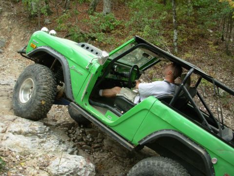 1983 Ford Bronco - This off-road vehicle navigates a challenging rocky incline, its capabilities.