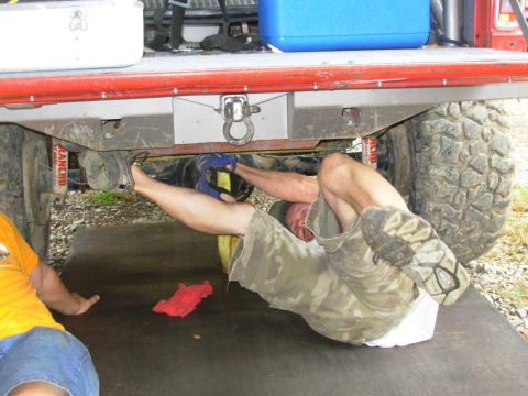 1983 Ford Bronco - Directly above his cap, you can see the axle tube broke all the way around. He's ratchet-strapping back together so it can be welded up. Se…
