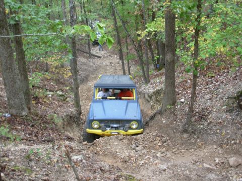 1983 Ford Bronco - Off-roading in a 1983 Ford Bronco on a forest trail with another vehicle following.