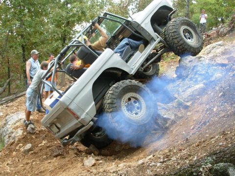 1983 Ford Bronco - This modified 1983 Ford Bronco navigates a challenging rocky terrain, kicking up blue smoke.