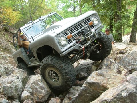 1983 Ford Bronco - This classic Ford Bronco navigates a challenging rocky terrain, its off-road capabilities.