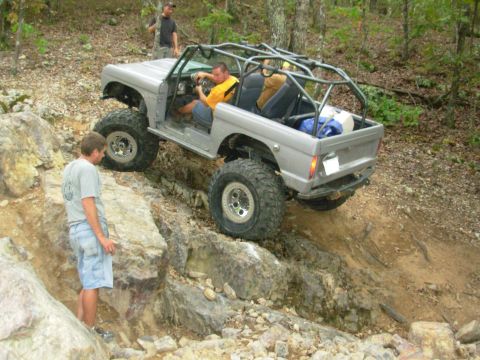 1983 Ford Bronco - This modified 1983 Ford Bronco navigates a challenging rocky terrain, its off-road capabilities.