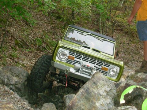 1983 Ford Bronco - This classic Ford Bronco is tackling a rocky trail with its front tires high off the ground.