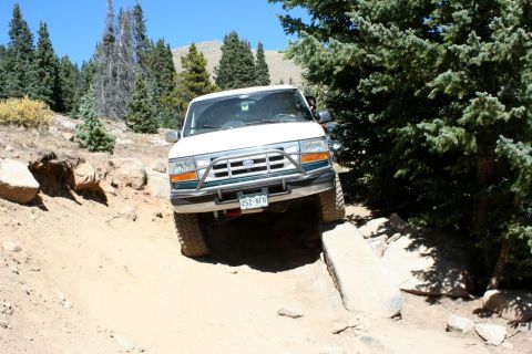 1996 Ford Bronco - This 1992 Ford Bronco navigates a challenging off-road path.