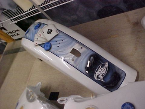 2010 Harley-Davidson Electra Glide - A motorcycle fender features a custom paint job with playing cards and a "Street Vibrations" logo.